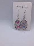 Boucles d'oreilles ovales papillons en résine