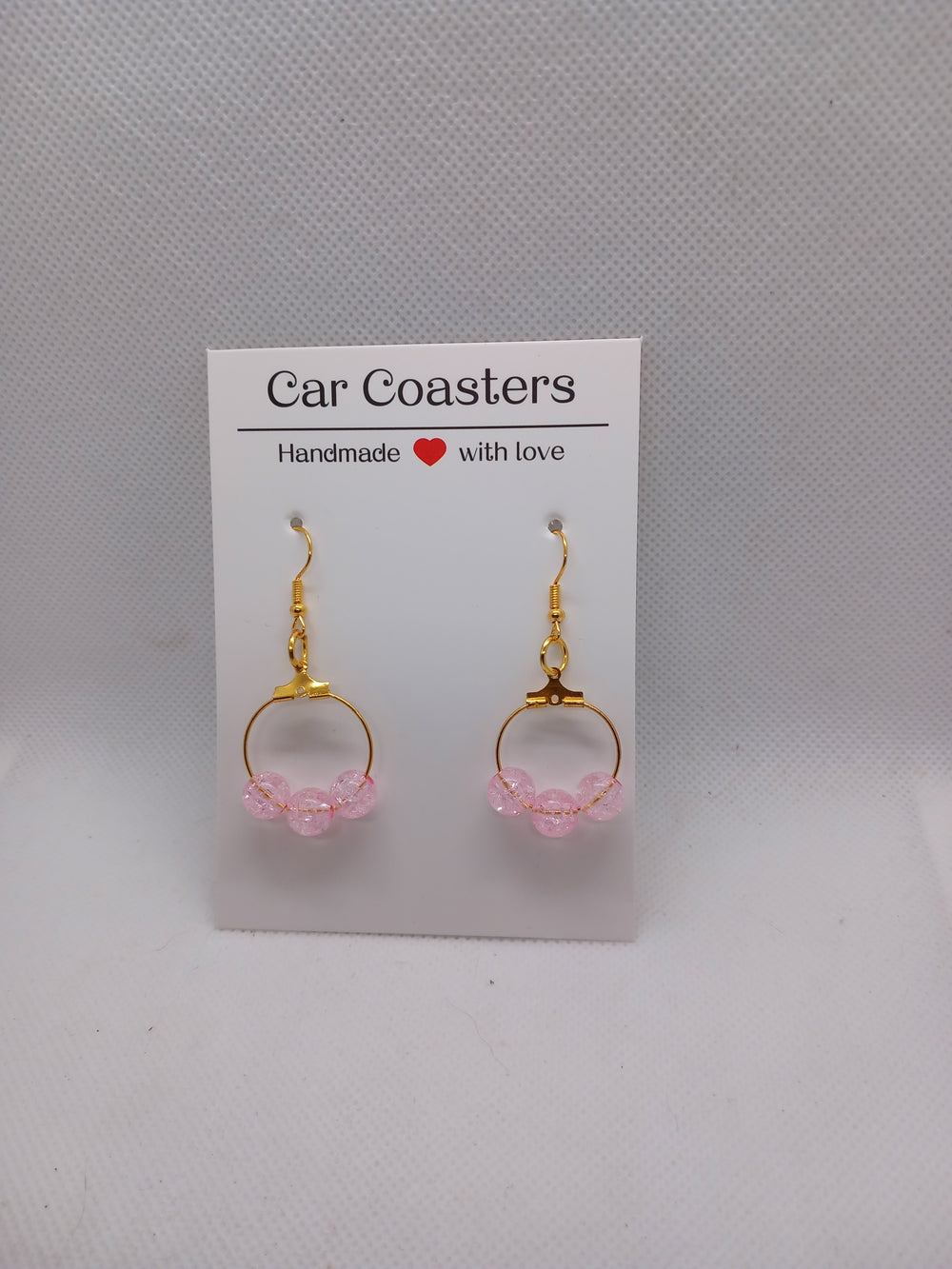 Boucles d'oreilles créoles plaquées or avec perles rose