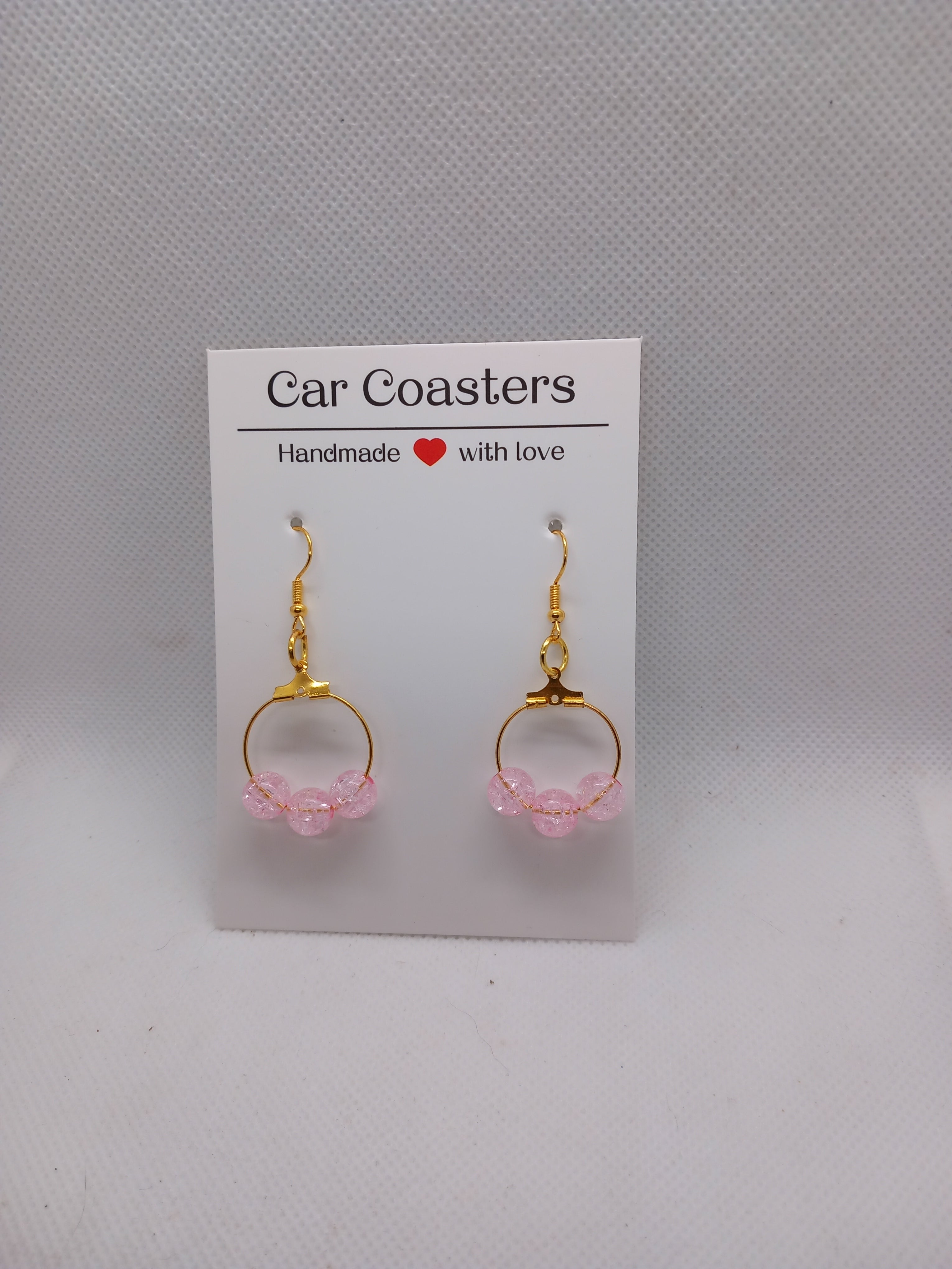 Boucles d'oreilles créoles plaquées or avec perles rose